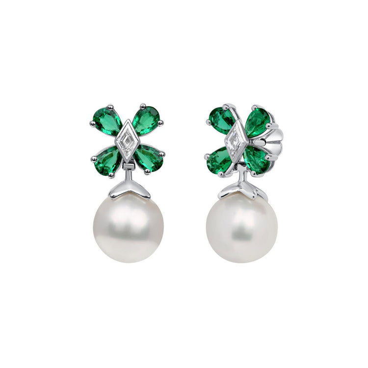 Earrings with a pearl hanging from a flower formed by pear-shaped emeralds and lozenge-shaped diamond center