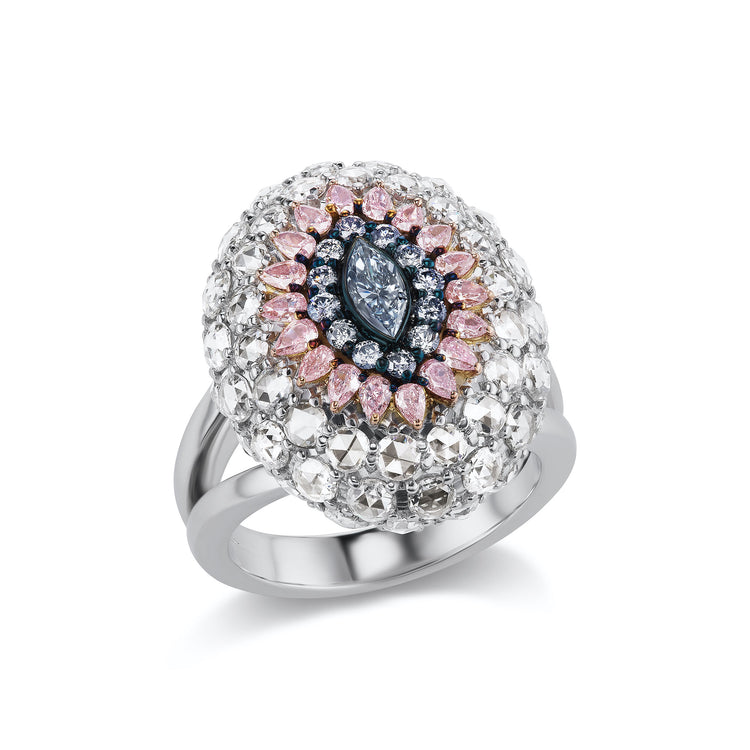 Close-up view of the Diamond Dome Ring. Center stone is a Marquise Fancy Blue Diamond. Center stone is surrounded by 0.53CTs of Pear Shape Fancy Purplish Pink Diamonds, 0.23CTs of Round Argyle Blue Diamonds , and 3.52CTs of White Diamonds. Set in 18K Pink and White Gold.
