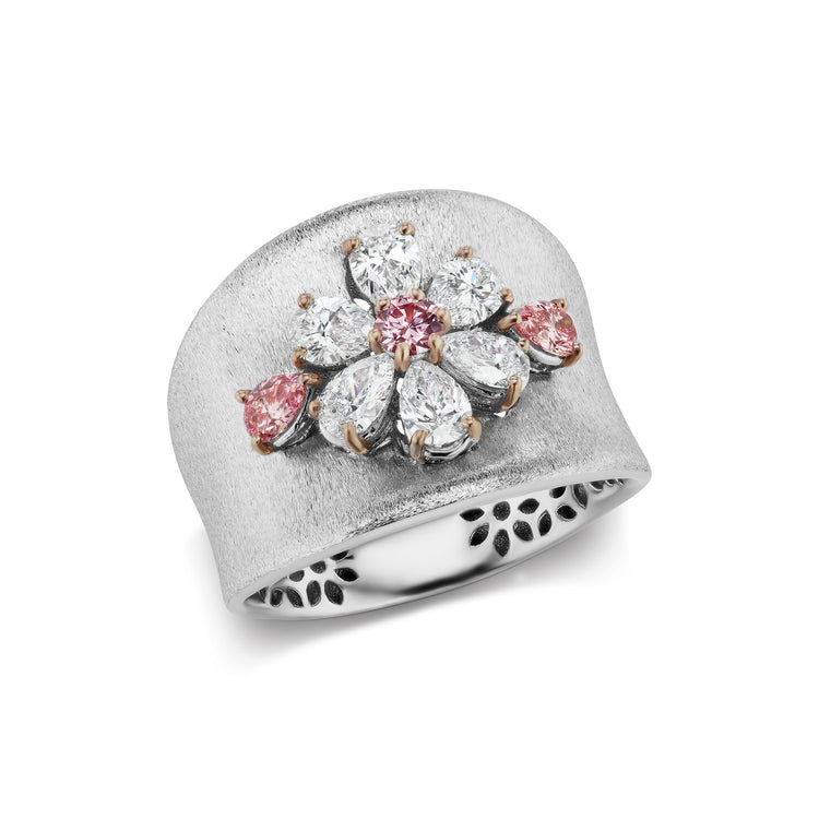 18K pink and white gold band with argyle pink and white diamonds forming a flower on the center of the ring