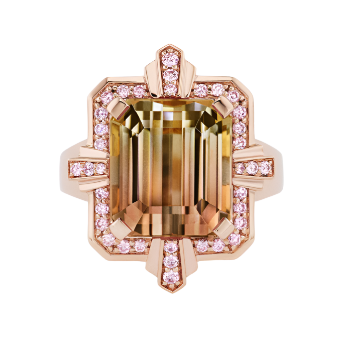 Close up view of the Tourmaline Cocktail Ring, which features a bi-colored tourmaline gemstone in the center surrounded by argyle pink diamonds set in 18k pink gold.
