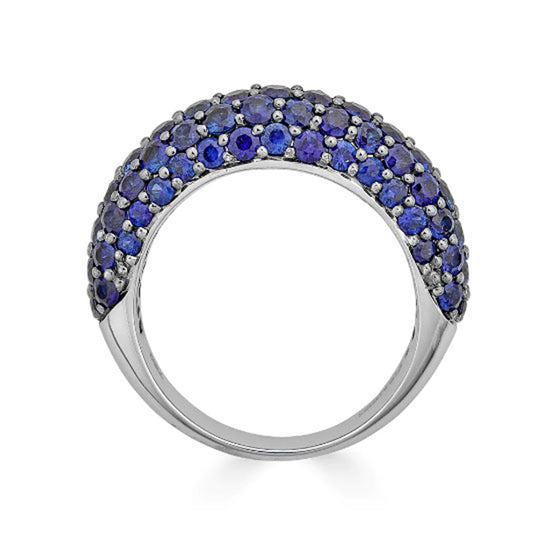 Small dome ring featuring round-cut blue sapphires on 18K white and black gold