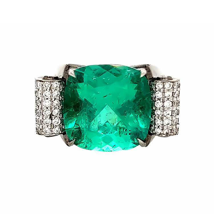 Close up view of the front of the cushion cut emerald engagement ring. The center stone is 10.66 carats. 