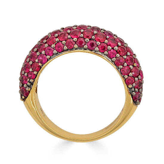 Small 18K black and yellow gold dome ring adorned with vibrant round-cut rubies