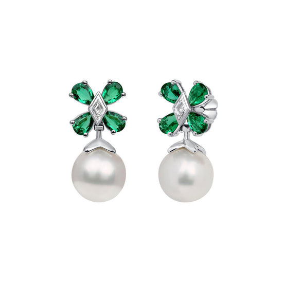 Earrings with a pearl hanging from a flower formed by pear-shaped emeralds and lozenge-shaped diamond center 