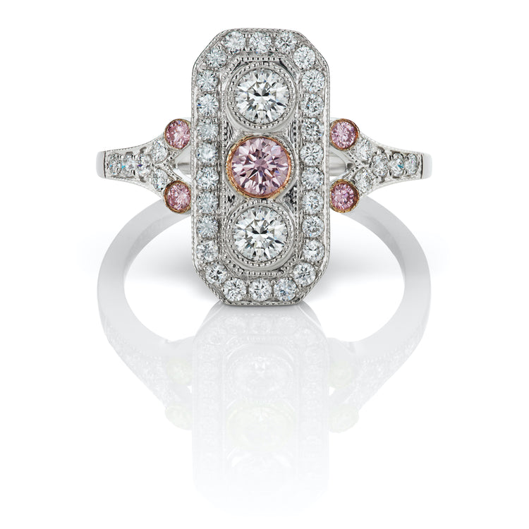 Close up view of the Rectangular Art Deco Diamond Ring in 18k White Gold. The center stone is a round fancy argyle pink diamond. 