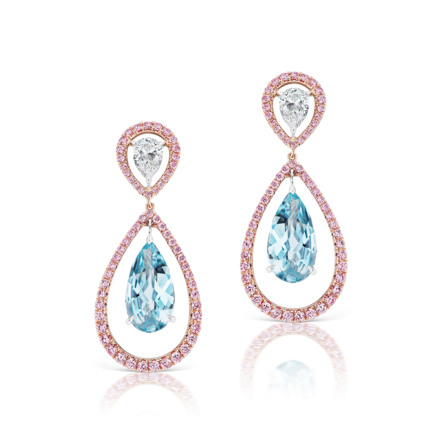 Close up view of the Aquamarine Drop Earrings. Featuring round pink diamonds, two pear shaped white diamonds, and two aquamarine diamonds set in pink gold and white gold.