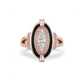 Close up view of an oval diamond cocktail ring. Featuring an oval diamond at the center surrounded by argyle pink diamonds. 
