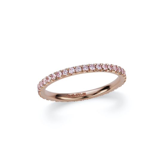 Close up of the Pink Diamond French Pave Eternity Ring. Featuring certified argyle pink diamonds set in 18k rose gold. 
