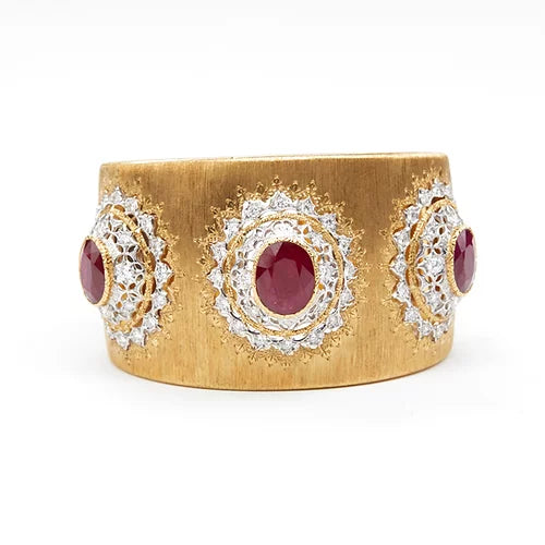 Vintage Buccellati cuff featuring oval Burmese rubies surrounded with diamonds forming a floral pattern around each ruby