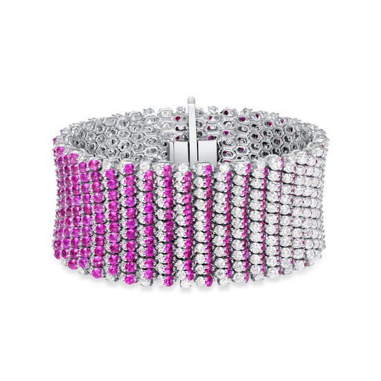 Unique 18K gold bracelet featuring deep red rubies followed by different shades of pink sapphire to create an ombre effect