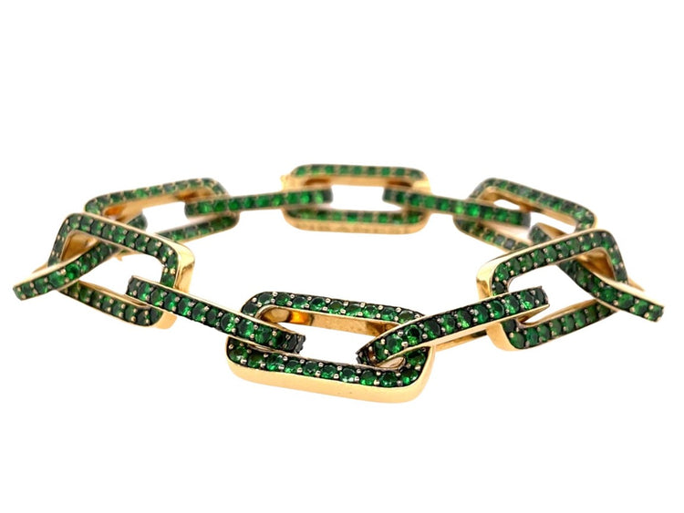 18K yellow gold twelve link bracelet, each adorned with round-cut green tsavorite