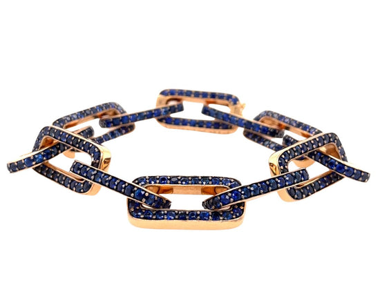 18K rose gold twelve link bracelet, each adorned with round-cut blue sapphires