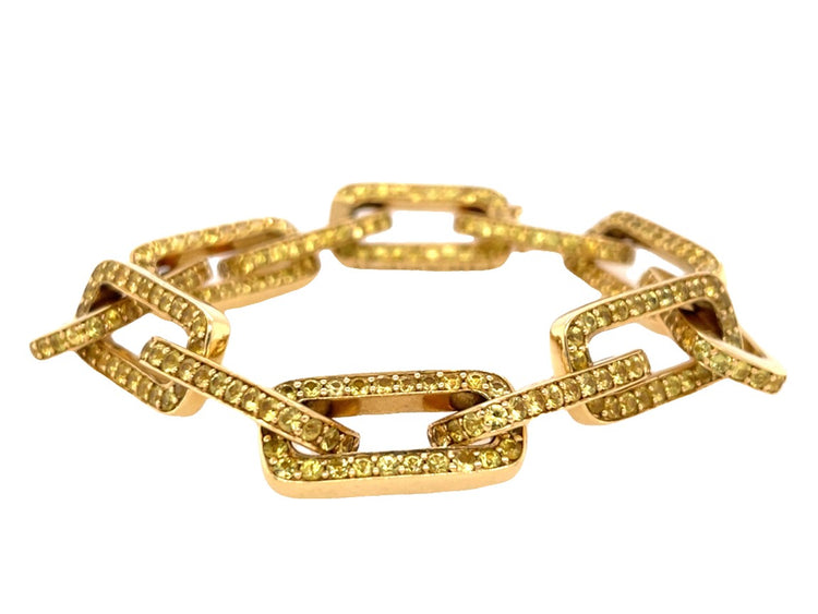 18K yellow gold twelve link bracelet, each adorned with round-cut yellow sapphires