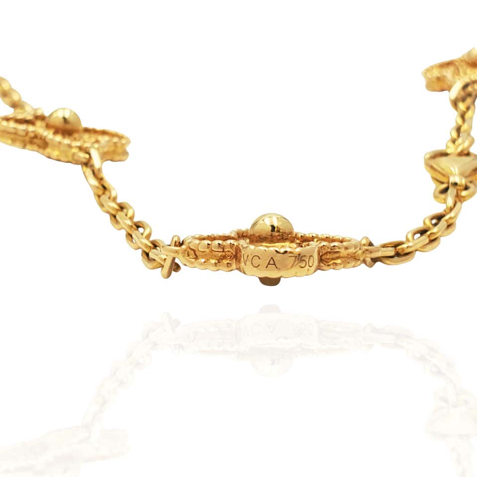 View from the back of the VCA Alhambra Necklace. Inscription reads "VCA 750"