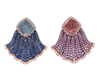 Close up view of the aquamarine and pink tourmaline earrings. Featuring one 8.39CT Aquamarine, one 9.15CT Pink Tourmaline, 12.03CTs of Blue and Pink Sapphires, and 2.05cts of Diamonds Set in 18K Pink and Black Gold. 