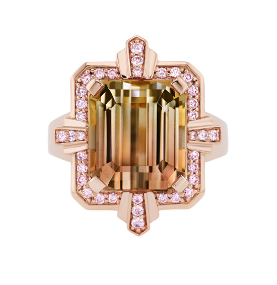 Close up view of the Tourmaline Cocktail Ring, which features a bi-colored tourmaline gemstone in the center surrounded by argyle pink diamonds set in 18k pink gold. 