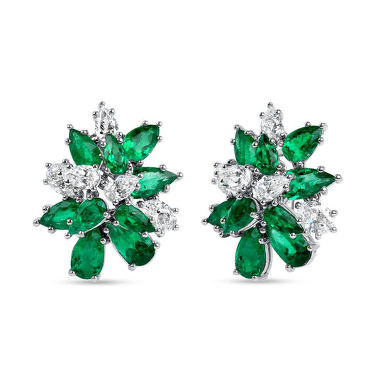Earrings featuring a cluster of pear and oval emerald and white diamonds