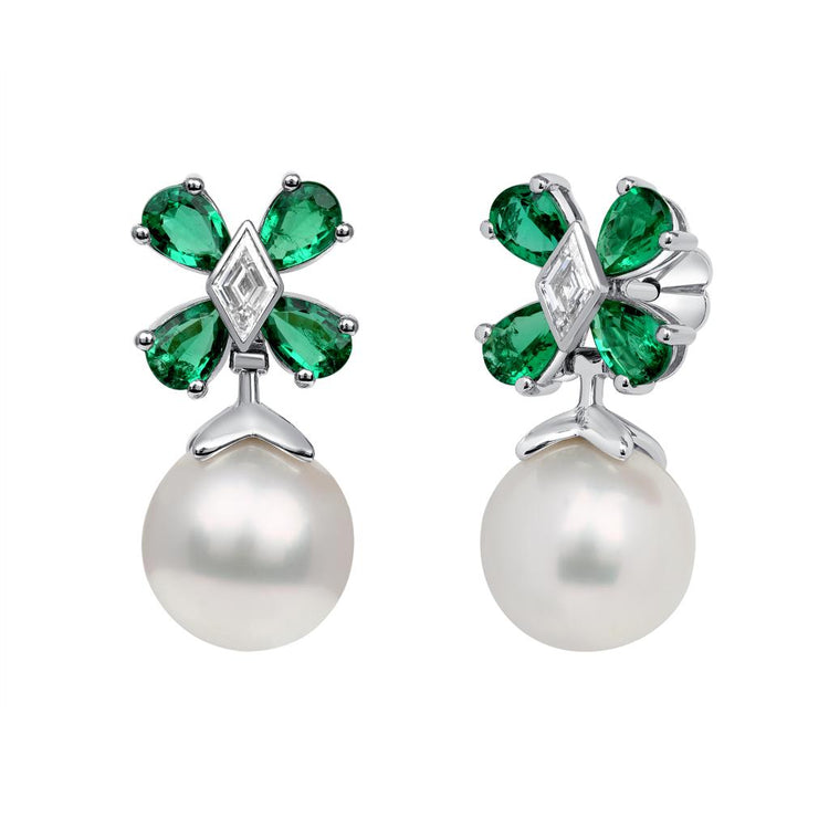 Earrings with a pearl hanging from a flower formed by pear-shaped emeralds and lozenge-shaped diamond center 