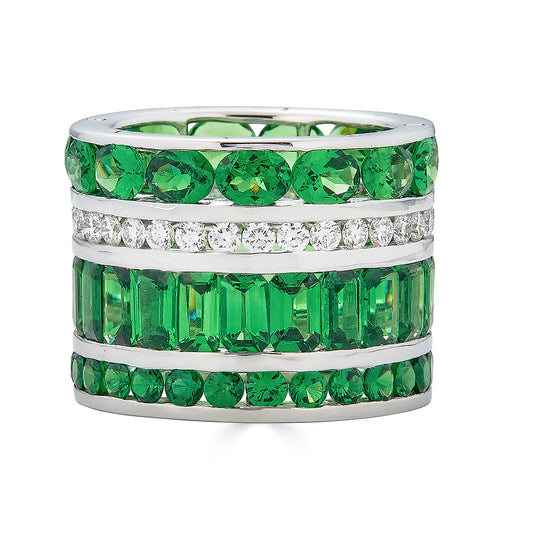 Stack ring featuring three rows of round-cut, oval-cut, and emerald-cut green tsavorite and one row of round-cut diamonds